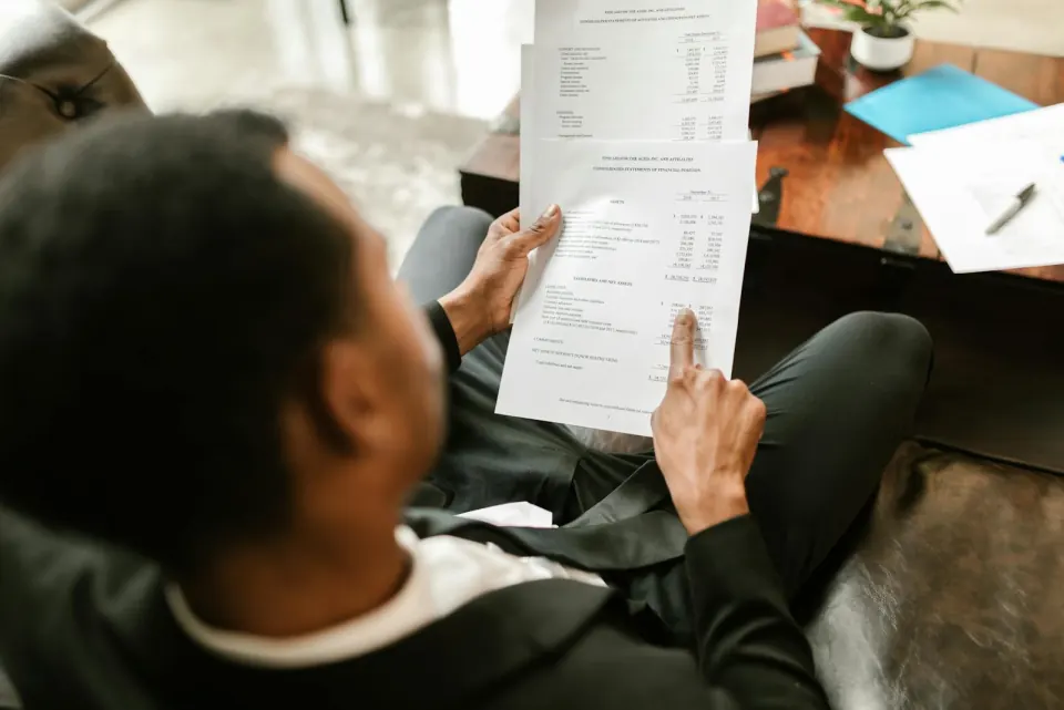 Credential documents being inspected for authenticity during surgeon verification